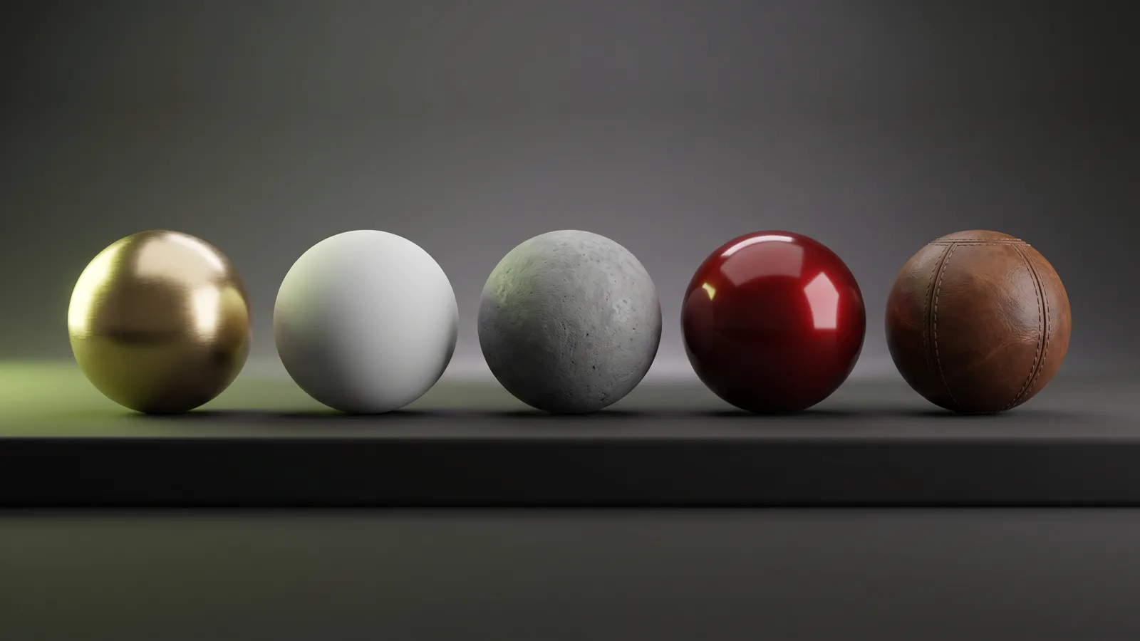 Five PBR material sample spheres — brushed gold, matte ceramic, concrete, polished red car paint, and worn leather — in a studio render