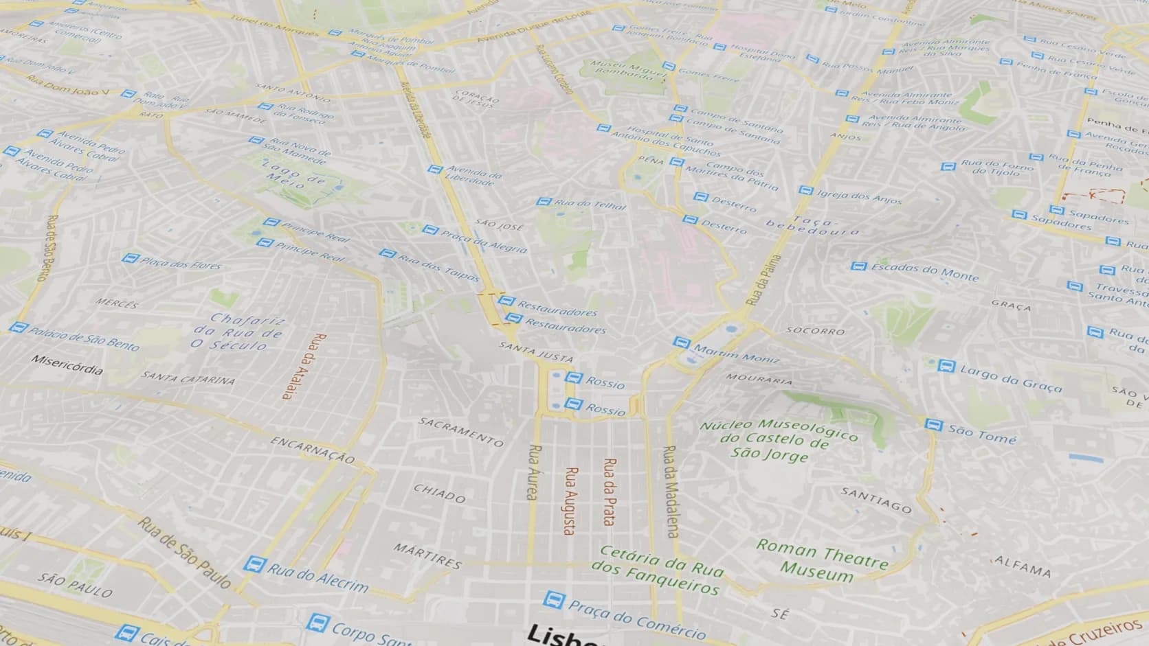 Central Lisbon draped with a street map showing Rossio, Baixa and Alfama on the real hills
