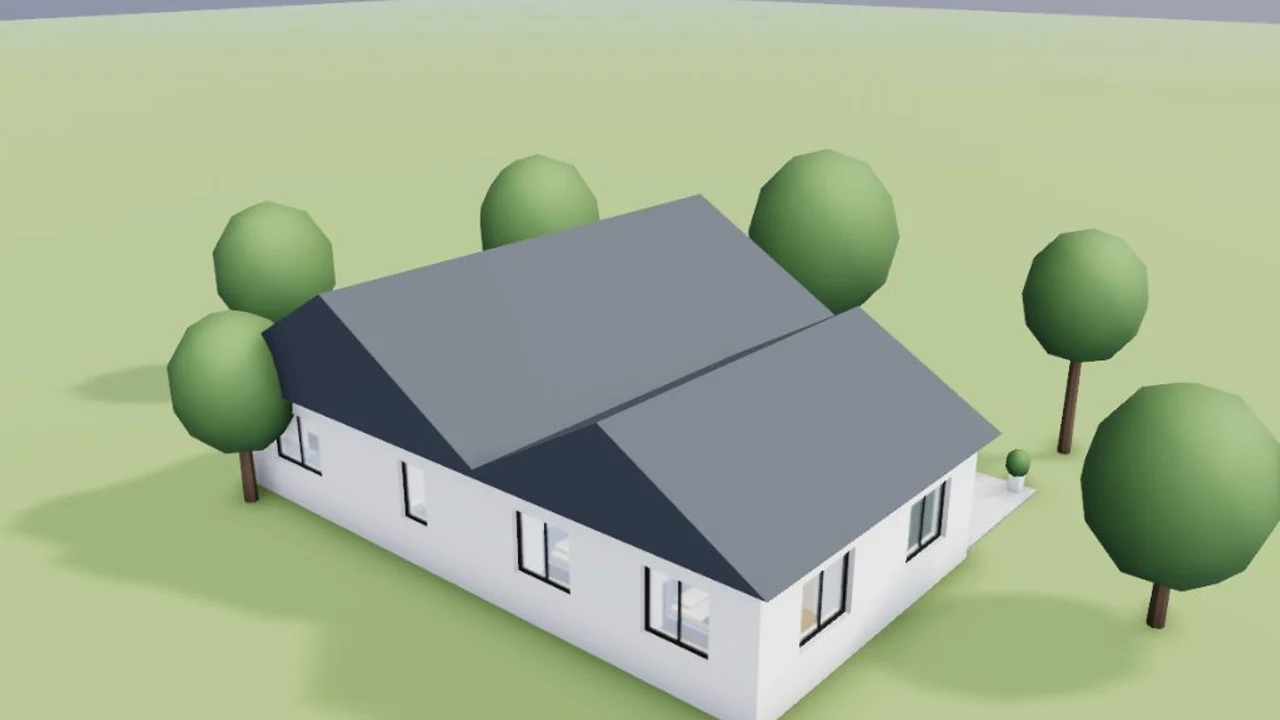 Aerial view of an L-shaped house with cross-gable roofs