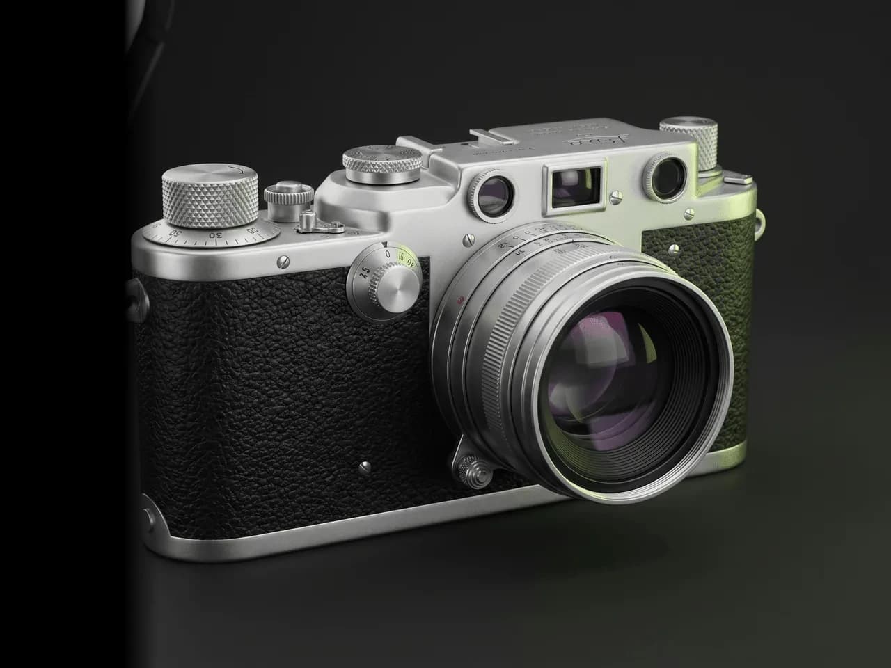 A vintage rangefinder camera textured in Mixos — leather grain, brushed metal and a glass lens — rendered in the viewport