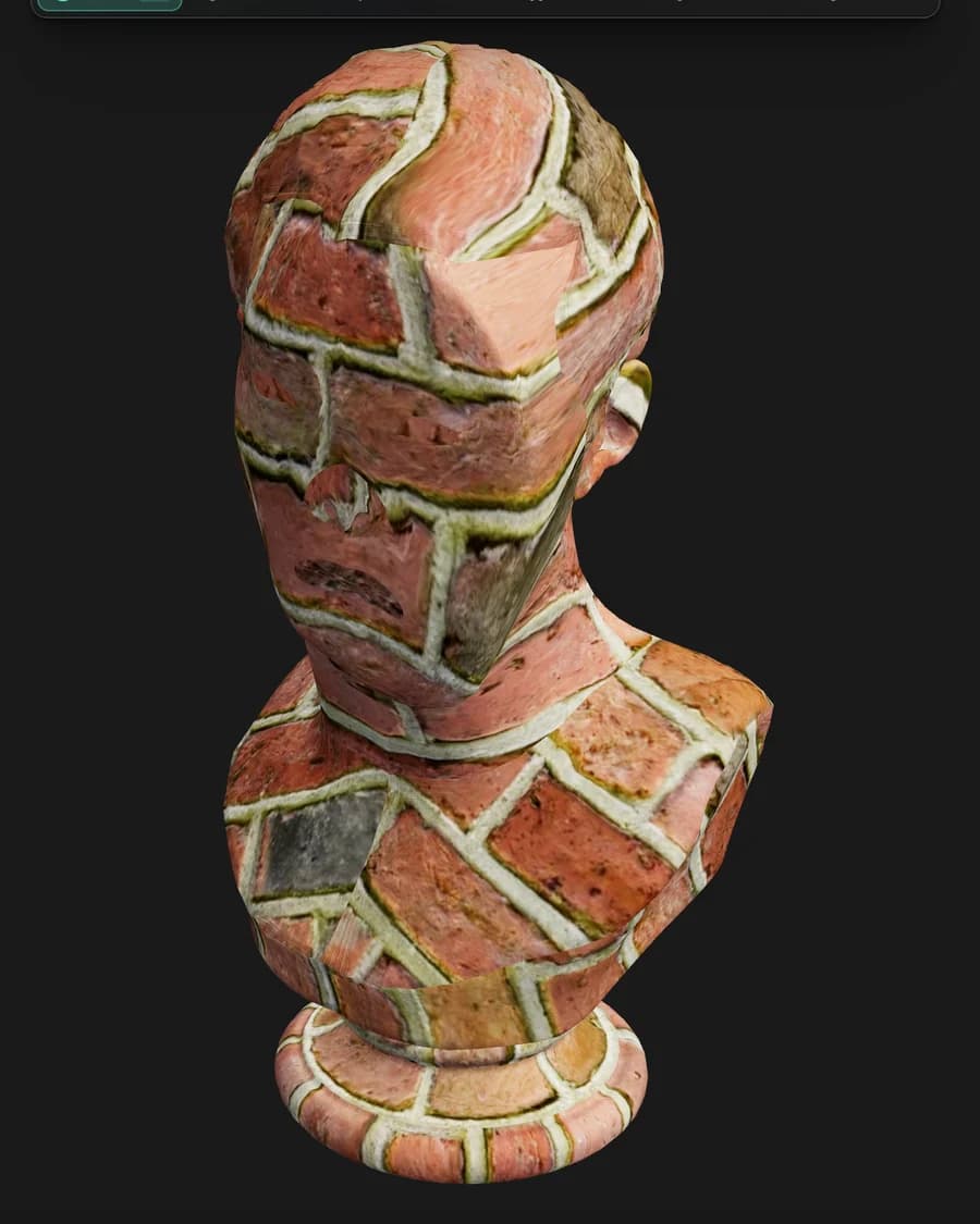 The same bust in Mixos Mold after sculpting has reshaped its base geometry. The brick courses have deformed with the new surface rather than sliding across it — every brick still sits on the part of the face it started on.