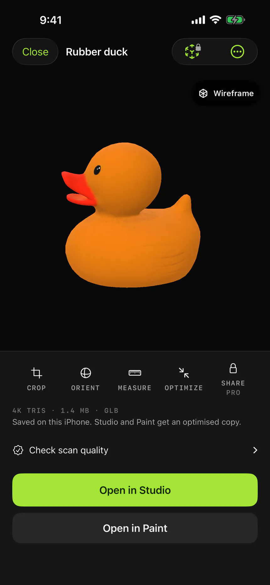 A finished object scan of a rubber duck in the iPhone preview, with its triangle count, file size and format, and buttons to open it in Studio or Paint.