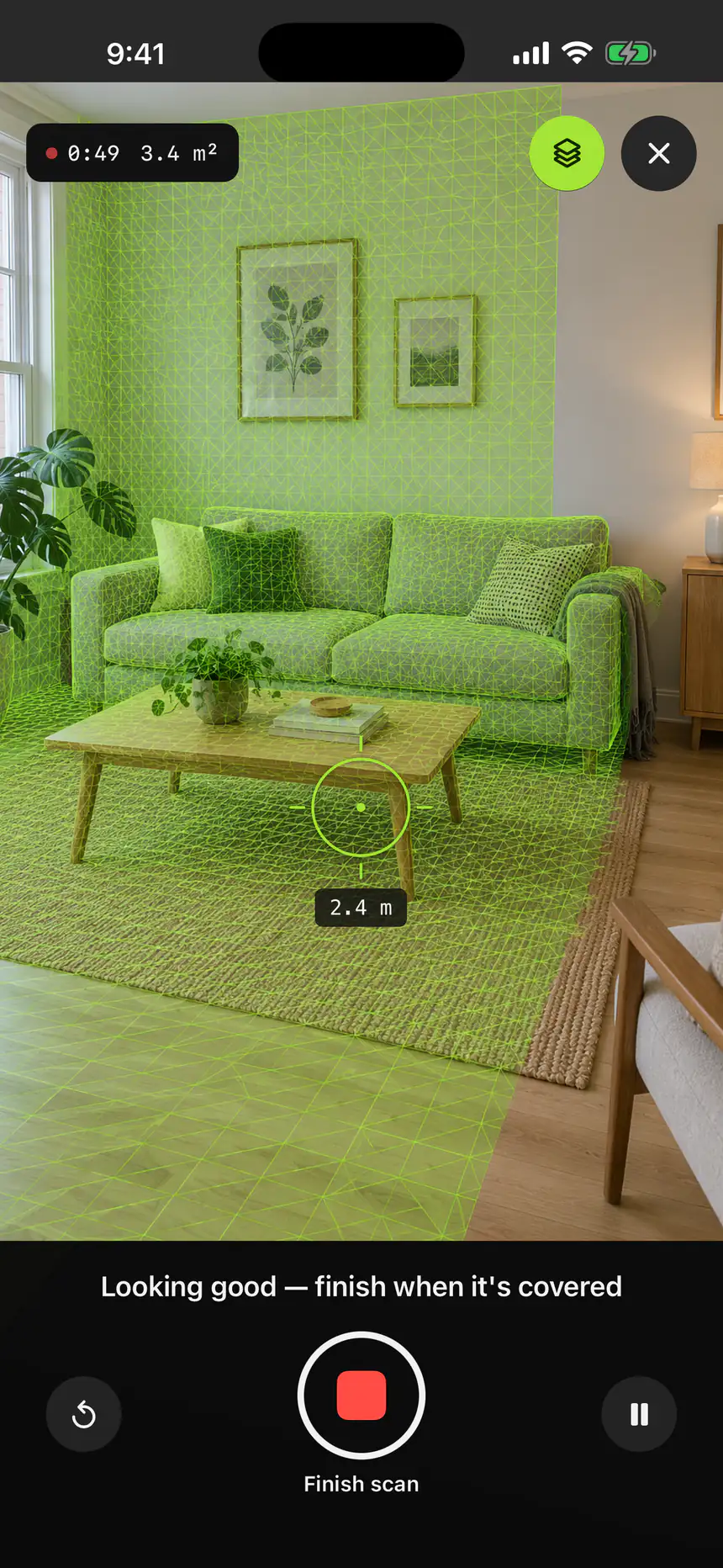 Space mode on iPhone: a living room overlaid with the live mesh as it is captured, with the elapsed time, the floor area so far and a Finish scan button.